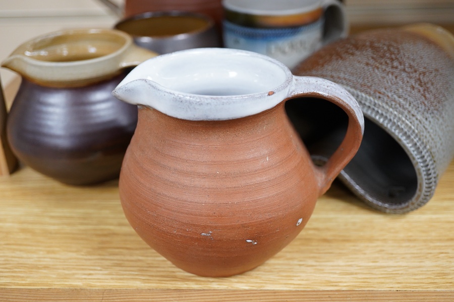 Guy Sydenham (1916-2005), studio pottery comprising a wall pocket, two jugs, Doris (sister-in-law) mug, coffee pot and cover, and a beaker, largest 19cm high